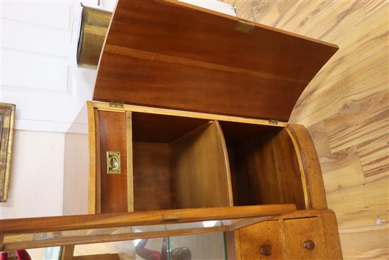 An Art Deco birds eye maple display cabinet and similar dining table,